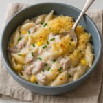 Creamy tuna mornay pasta bake with golden breadcrumb topping and chives in a stoneware bowl Tuna mornay recipe, australian recipes.