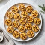 mini quiches recipe cooling on a wire rack after baking
