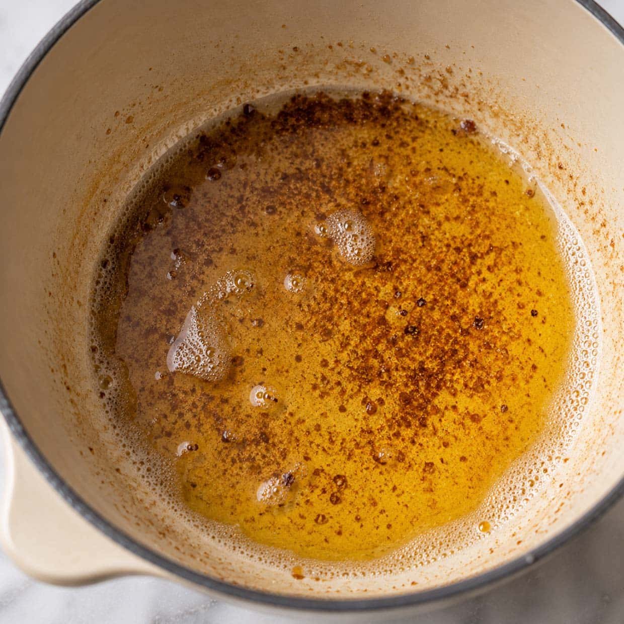 chocolate chip cookie recipe browned butter golden and nutty in light coloured saucepan