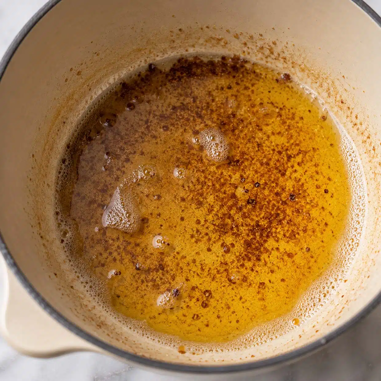 chocolate chip cookie recipe browned butter golden and nutty in light coloured saucepan