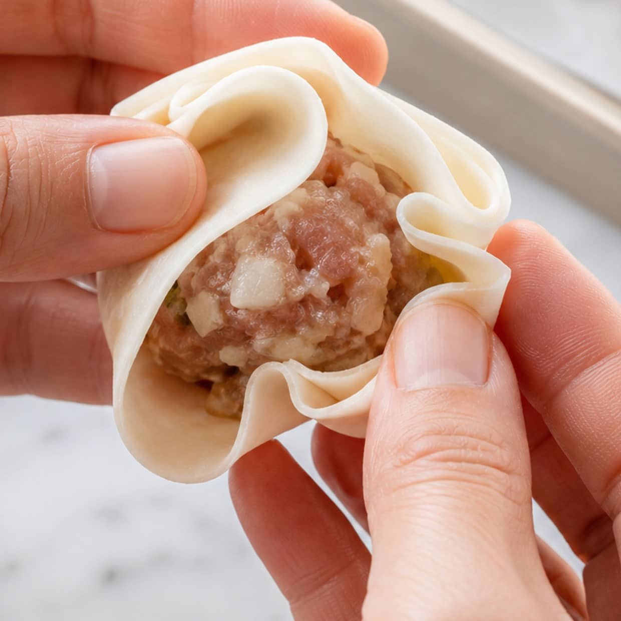 dim sim recipe wrapping and pleating gow gee wrapper around pork filling