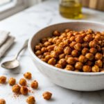roasted chickpeas seasoned with smoked paprika in a white ceramic bowl