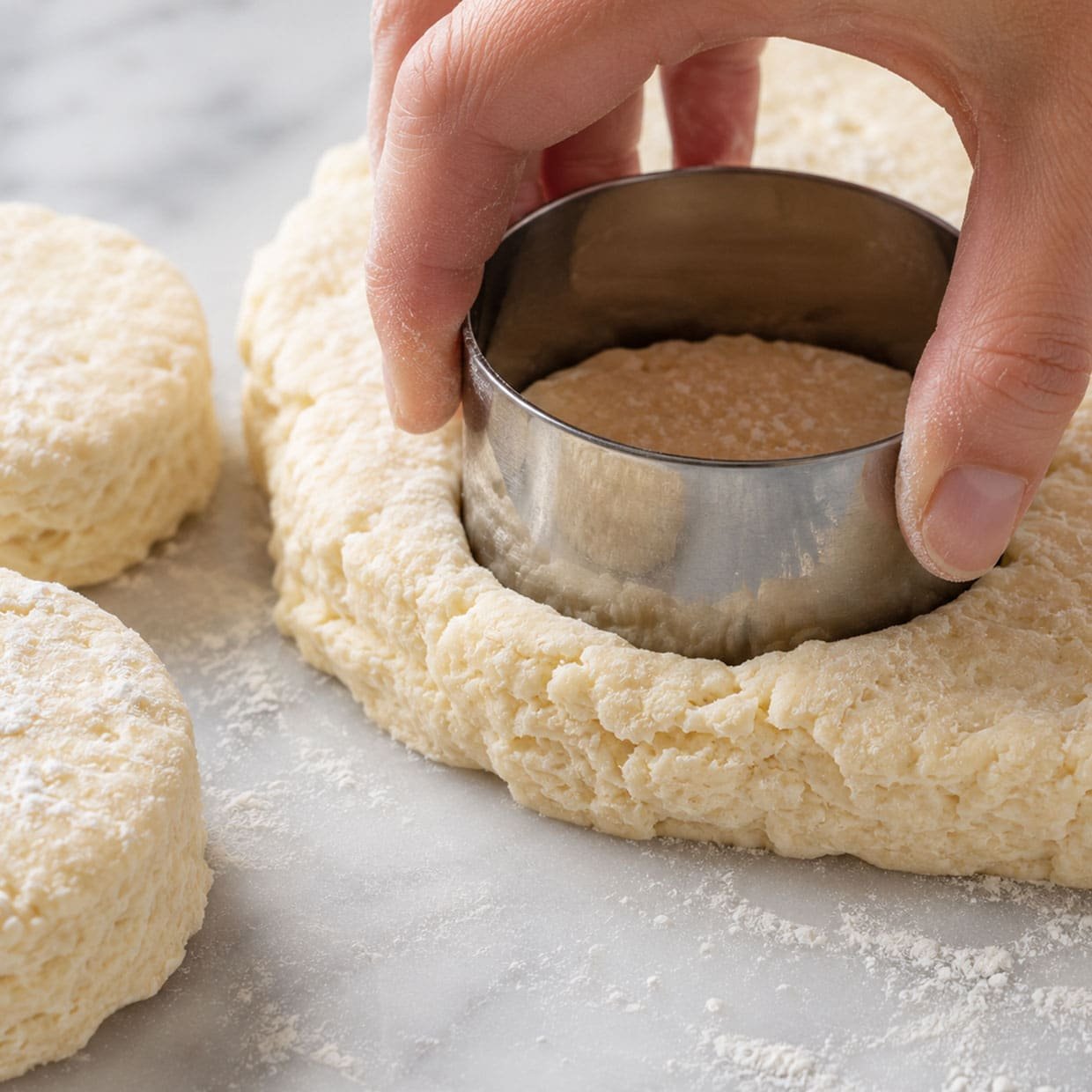 scone recipe pressing round cutter straight down into scone dough without twisting